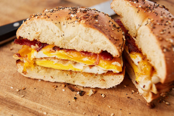 Close up of Bacon, Egg, & Cheese Sandwich on Everything Bagel Cut in Half