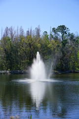 Naklejka premium a beautiful blue lake with geyser