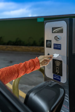 Hand taking a parking ticket