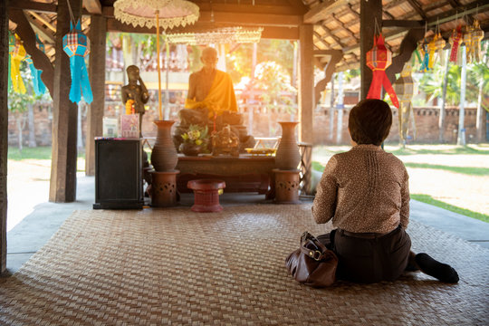 Thai buddhism people in buddhist pray for benefaction worship to Buddha at temple