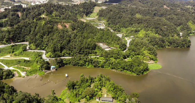 The landscape of the Cameron Highlands, Malaysia from the sky. Aerial birds eye view over a dam in the Malaysian Cameron highlands. A drone capture of the highland landscape in the center of Malaysia