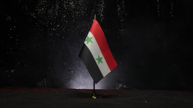 Closeup, flags on dark background. Concept of crisis of war and political conflicts between nations. Selective focus
