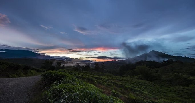 Fast moving clouds during sunset at Sabah, Borneo, Malaysia, a sunset time lapse with motion control on a tea plantation near by mount Kinabalu and Kota Kinabalu. Sunset time lapse 