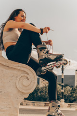 Girl putting on roller skates