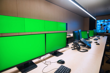 Empty office, desk, and chairs at a main CCTV security data center.