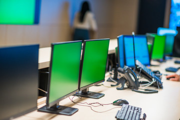 Modern surveilance control room and computer CCTV monitors.