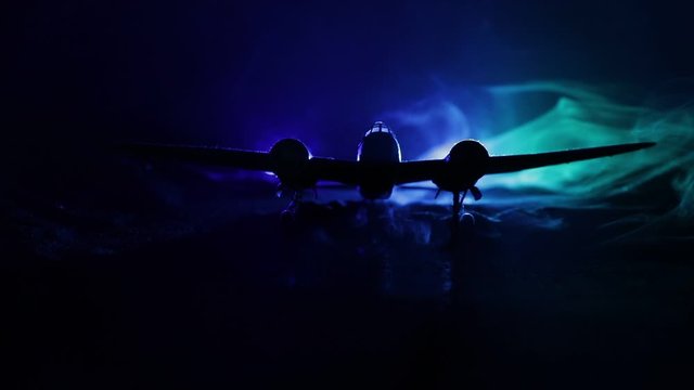 German Junker (Ju-88) night bomber at night. Artwork decoration with scale model of jet-propelled plane in possession. Toned foggy background with light. War scene. Selective focus