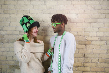 Happy Young Couple Wearing Costumes to Celebrate St. Patrick's Day. - Powered by Adobe