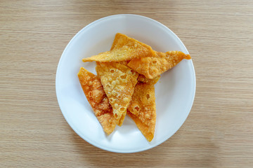 Thai Fried Wonton in a bowl on wood table