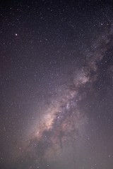 The stars and the milky way in the dark sky at night are very beautiful.