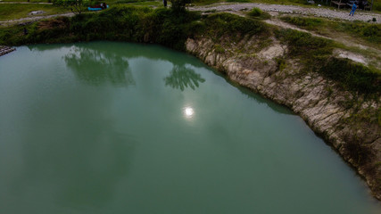 Aerial view beautiful green lake and surrounded by green grass