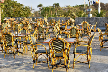  wicker chairs arranged for diners attention 