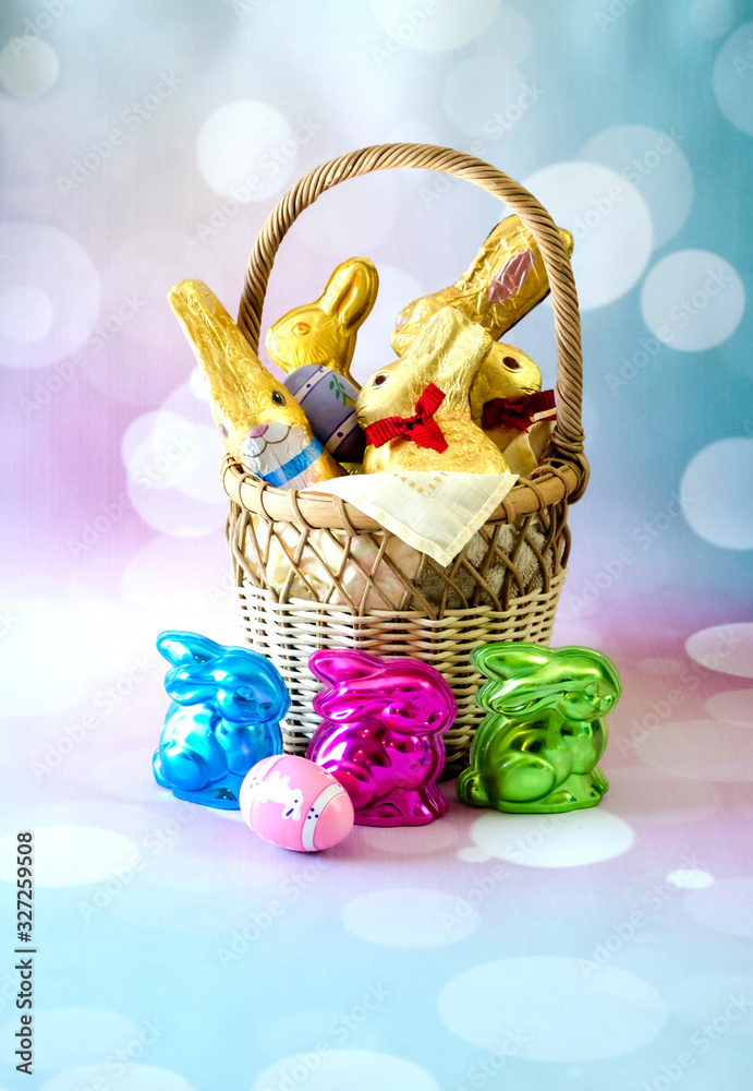 Wall mural Fancy easter basket filled with chocolate bunnies