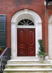 Fototapeta na wymiar elegant wooden front door of old townhouse or apartment building