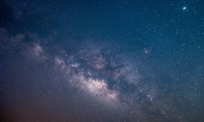 The stars and the milky way in the dark sky at night are very beautiful.