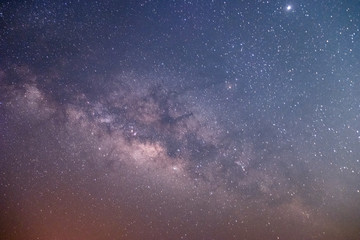 The stars and the milky way in the dark sky at night are very beautiful.