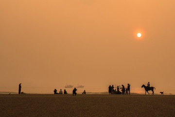 Fototapeta na wymiar marina beach, Chennai - September 11 2019: Wide angle view of sunrise at the Marina beach in Chennai.