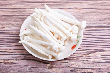 Fresh white mushrooms on a plate