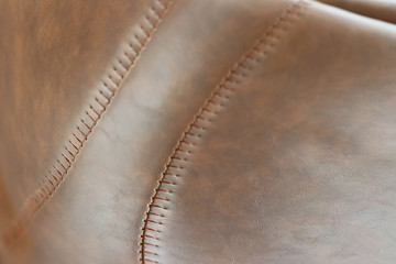 Close up detail of brown leather stools