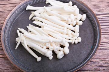 Fresh white mushrooms on a plate