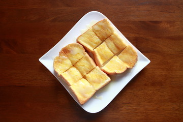 Top view. Butter Sweetened Condensed Milk on Toast.