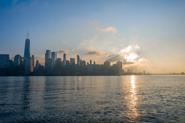 Fototapeta premium New York City Skyline from Hudson River in sunset, aerial photography 