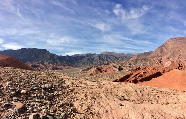 Naklejka premium Red Argentinian desert and stones in La Quebrada de Cafayate
