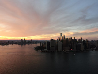 Fototapeta premium Shot from Brooklyn toward New York downtown and Jersey City in sunset, aerial photography