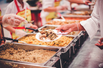 Sharing food with the poor in Thailand