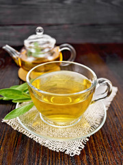 Tea herbal with sage in glass cup on napkin