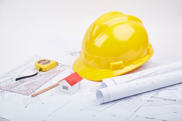 Yellow hard hat tools and drawings