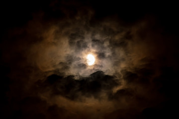 The moon in a cloudy sky