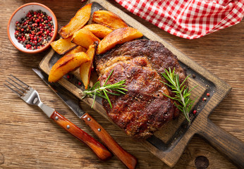 grilled meat with rosemary and potato, top view
