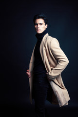 Fototapeta premium handsome asian fashion looking man posing in studio on black background, lifestyle modern people concept