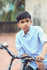 Obraz premium Portrait of Indian boy posing to camera 