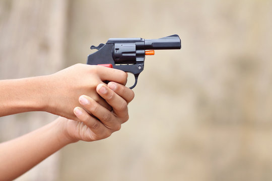Little boy holding the toy gun on Diwali Occasion