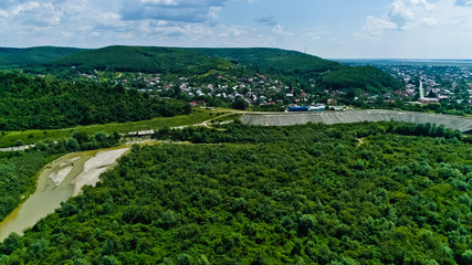 Drone view of a river crossing a beautiful forest landscape