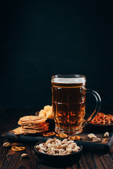 Beer, salted nuts and crunchy snacks. Oktoberfest food, pub special offer, party concept