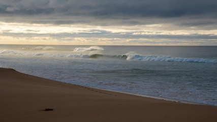 beautifull sandy beach and waves of the Atlantic Ocean. Portugal. Algarve.