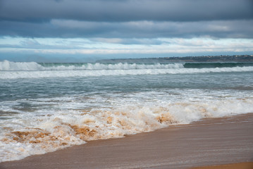 beautifull sandy beach and waves of the Atlantic Ocean. Portugal. Algarve.