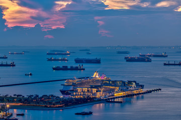 Cruise ship anchored at Singapore port at magic hour