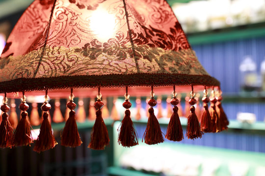 View Of Red Lampshade With Tassels