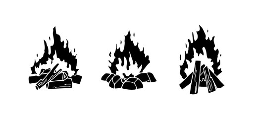 Obraz premium Set of monochrome vector illustrations isolated on a white background. Black silhouettes of burning bonfire. Outdoor adventure. Wild life. Camping hiking time.