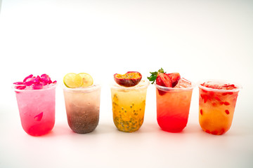 Glasses of fruit drink with iced isolated on white background 