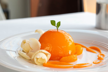  orange dome cake on white plate