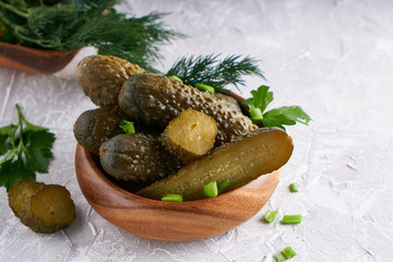 pickled cucumbers with herbs and onions in a plate on the table Probiotics food