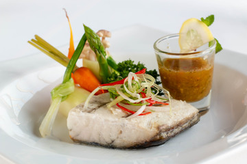  snow fish steak with sauce on plate