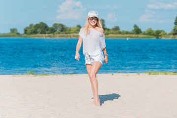 Fototapeta premium Travelling time. Cute european or american woman at vacation, stylish person 