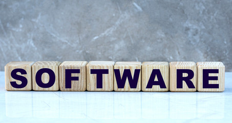 Obraz premium concept word software on cubes on a marble grey background