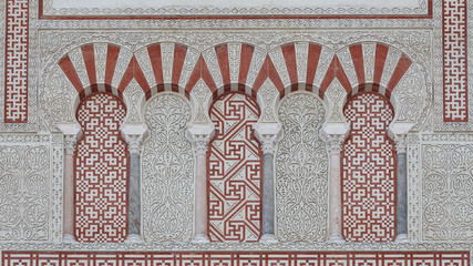 mezquita in cordoba, details, decoration over the external facade of wall of the mezquita in cordoba. andalusia. spain - 327288703